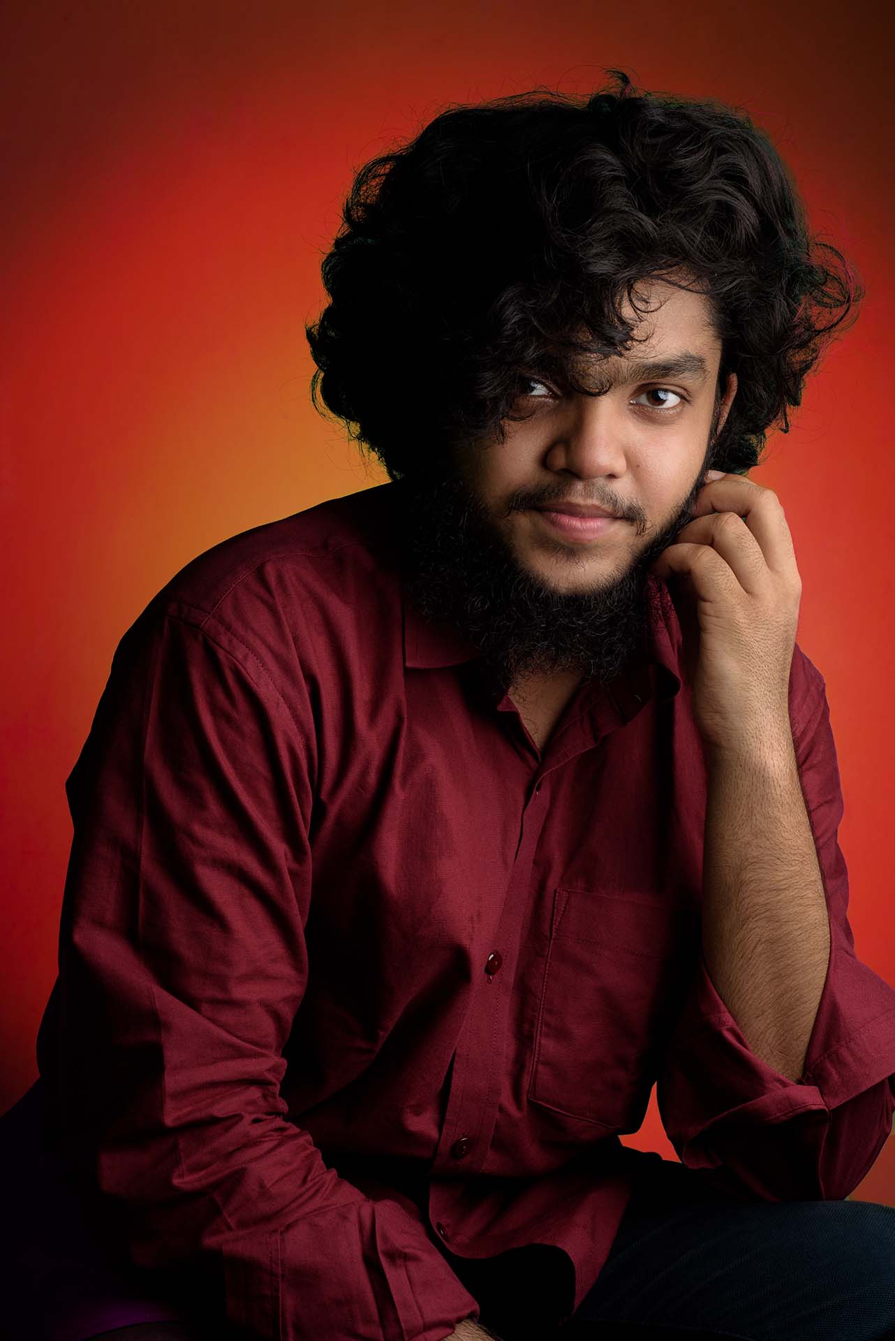 Professional photographer in maroon shirt